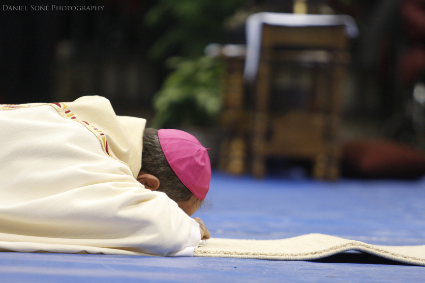 Bishop-elect Fernando Isern prostrates himself in humility during the Litany of Saints.