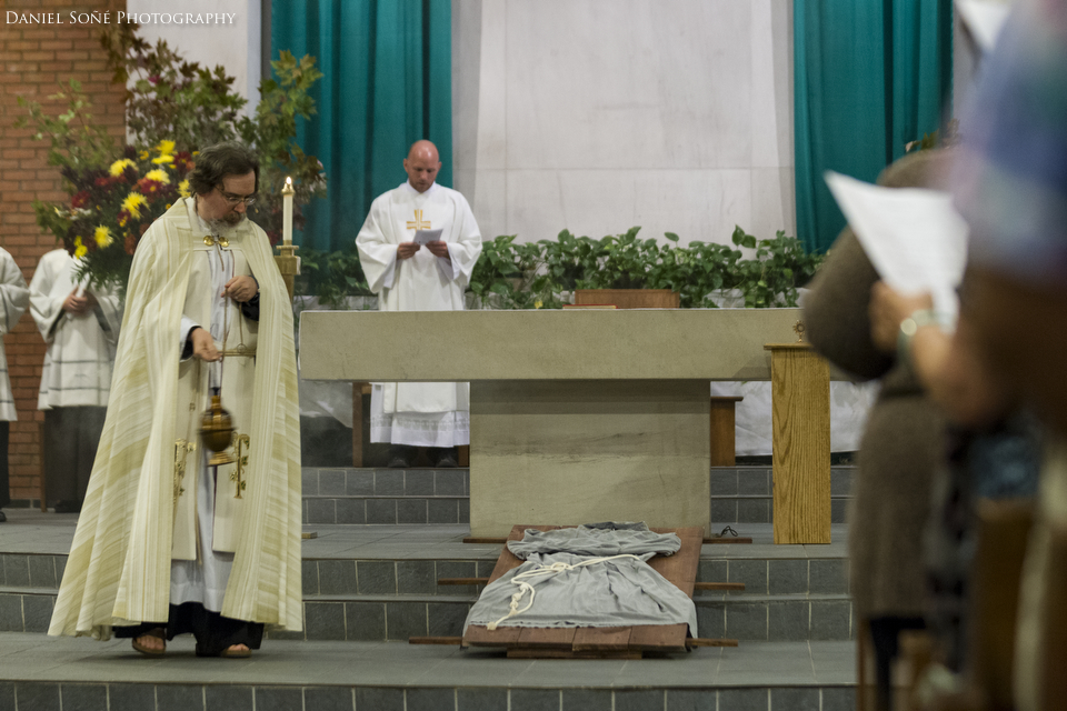 Father Seraphim Beshoner, TOR incenses the altar and the bier and habit of St. Francis of Assisi during the transits devotion at St. Camilus Church in Silver Spring, MD.