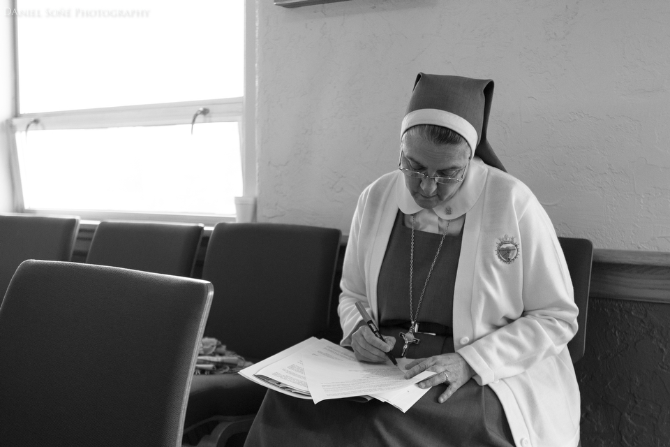 Foundress of the Servants of the Pierced Hearts of Jesus and Mary, Mother Adela Galindo, works on some notes in the chapel of the Spalding Pastoral Center in Peoria, IL. Mother Adela personally brought the rare relic of Blessed John Paul II to the Diocese of Peoria from Rome.