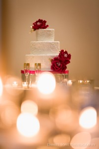 elegant red, gold, and white wedding details at the Carnegie Institute of Technology
