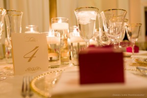 elegant red, gold, and white wedding details at the Carnegie Institute of Technology
